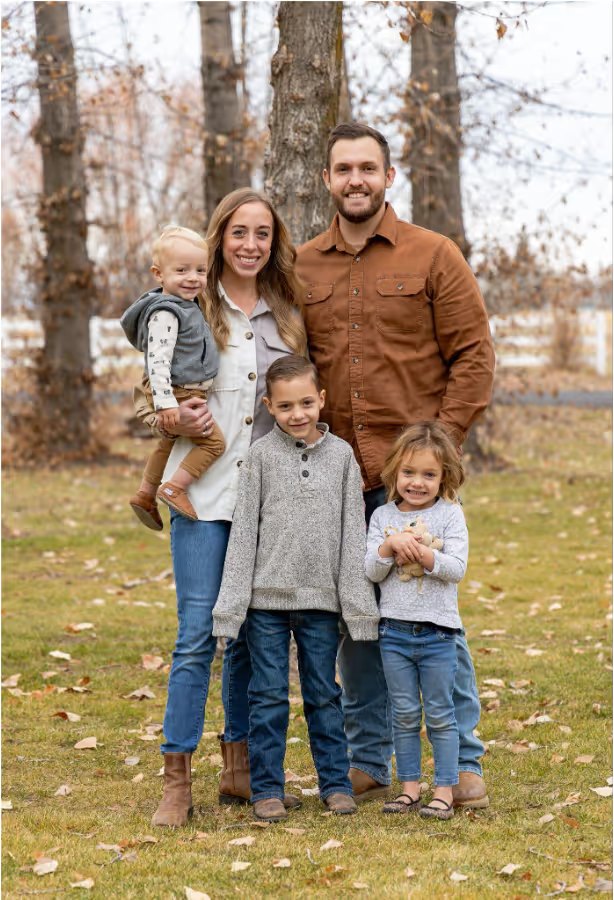 Isaac and Maddy Evans, owners of Pure Maintenance of Indy, with their three children