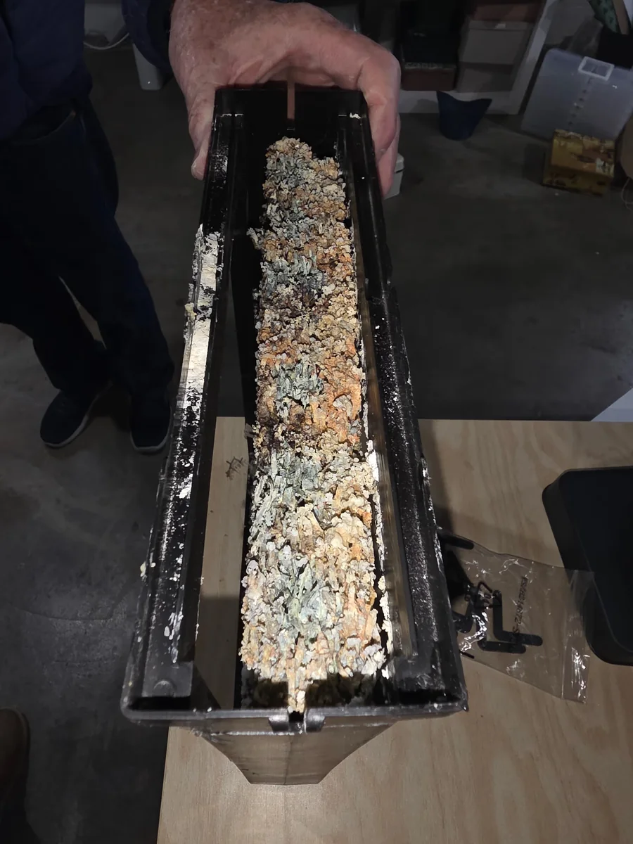 A heavily fouled drain pan lifted out of an air handler