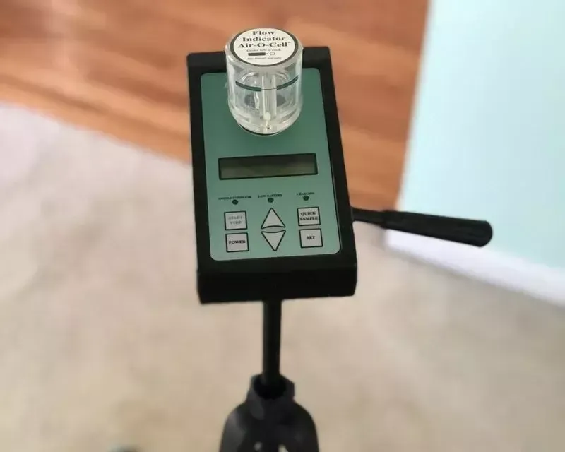 Spore-trap air sampling pump on a tripod during a Pure Maintenance of Indy mold inspection